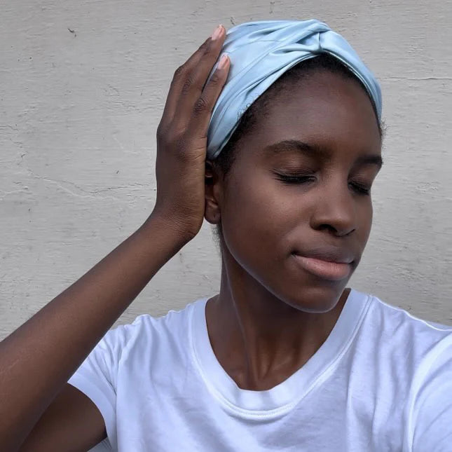 Customer wearing blue silk bonnet