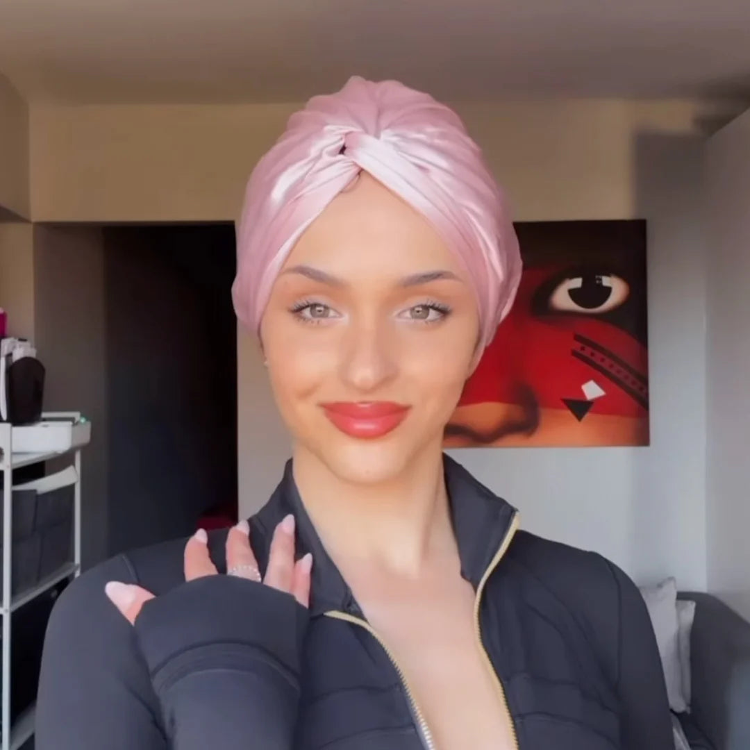 Customer wearing pink silk bonnet